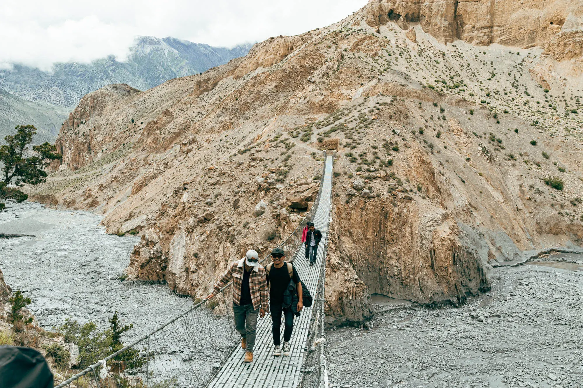 Hikers exploring scenic trails near Shinta Mani Mustang in the breathtaking landscapes of Upper Mustang, Nepal.