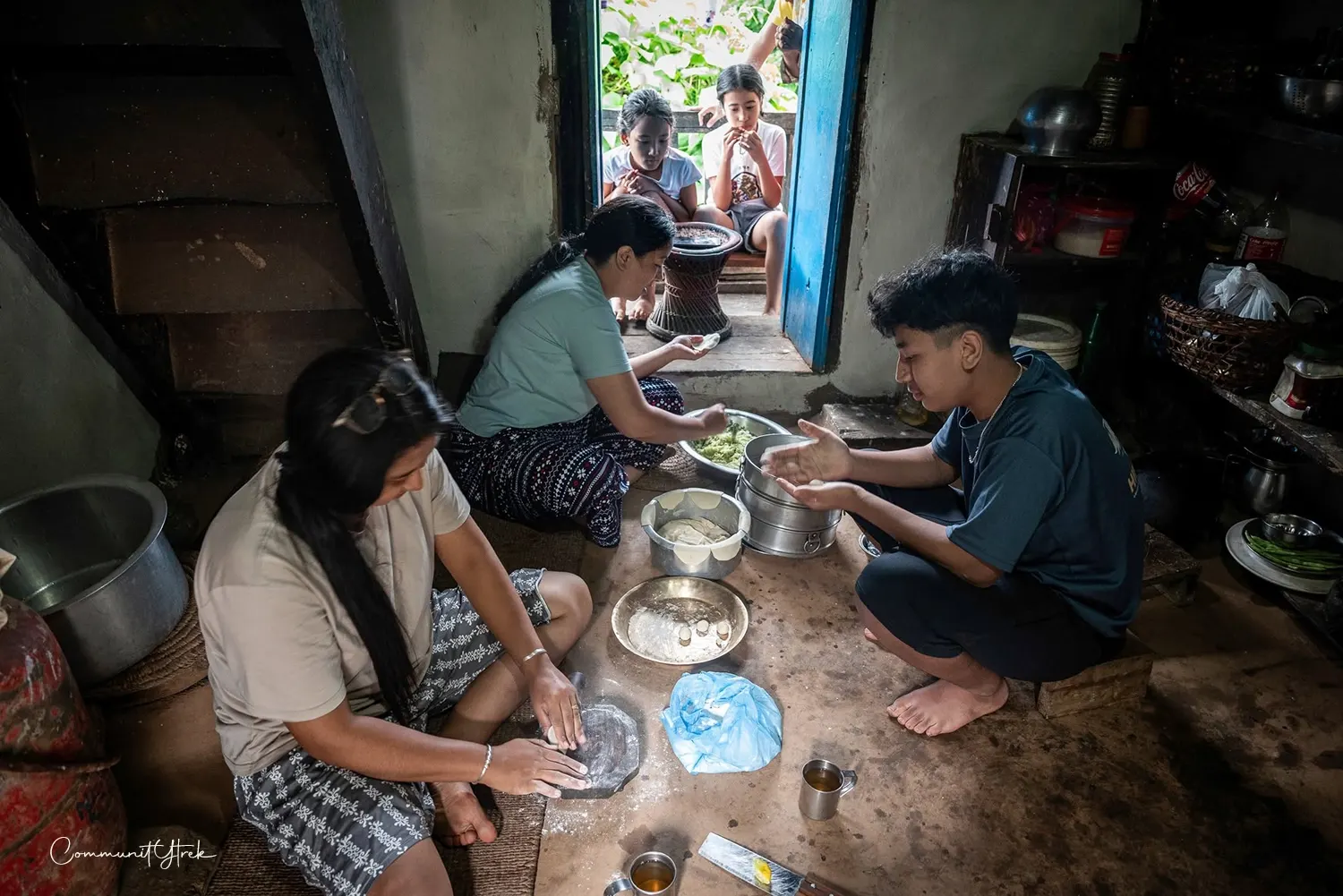 Traditional village life in Nepal, with local people, homes, terraced fields, and beautiful Himalayan surroundings.