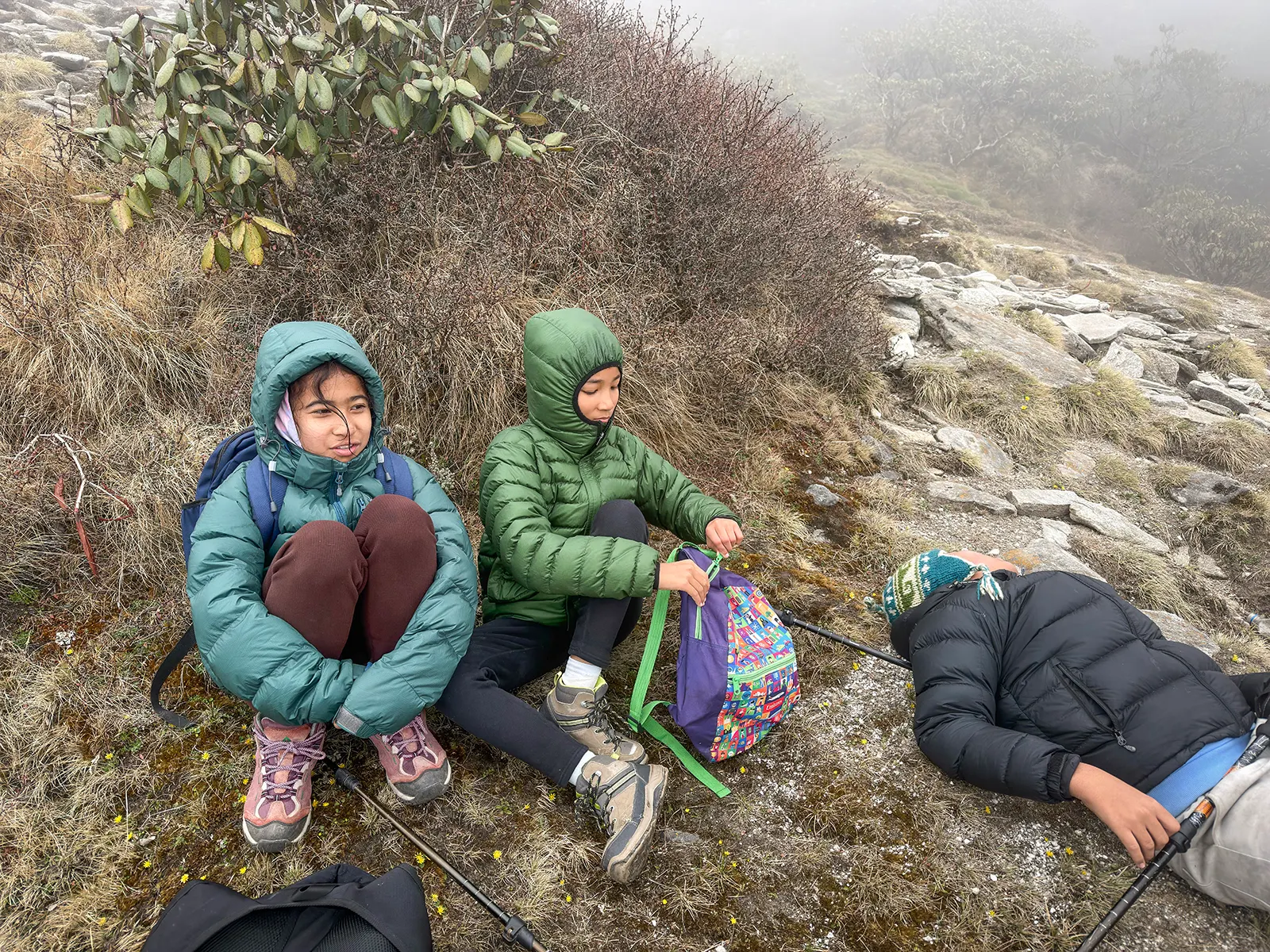 Even on the toughest trails, the biggest smiles come from the smallest adventurers. Resting near Pikey Peak Base Camp, surrounded by the nature.