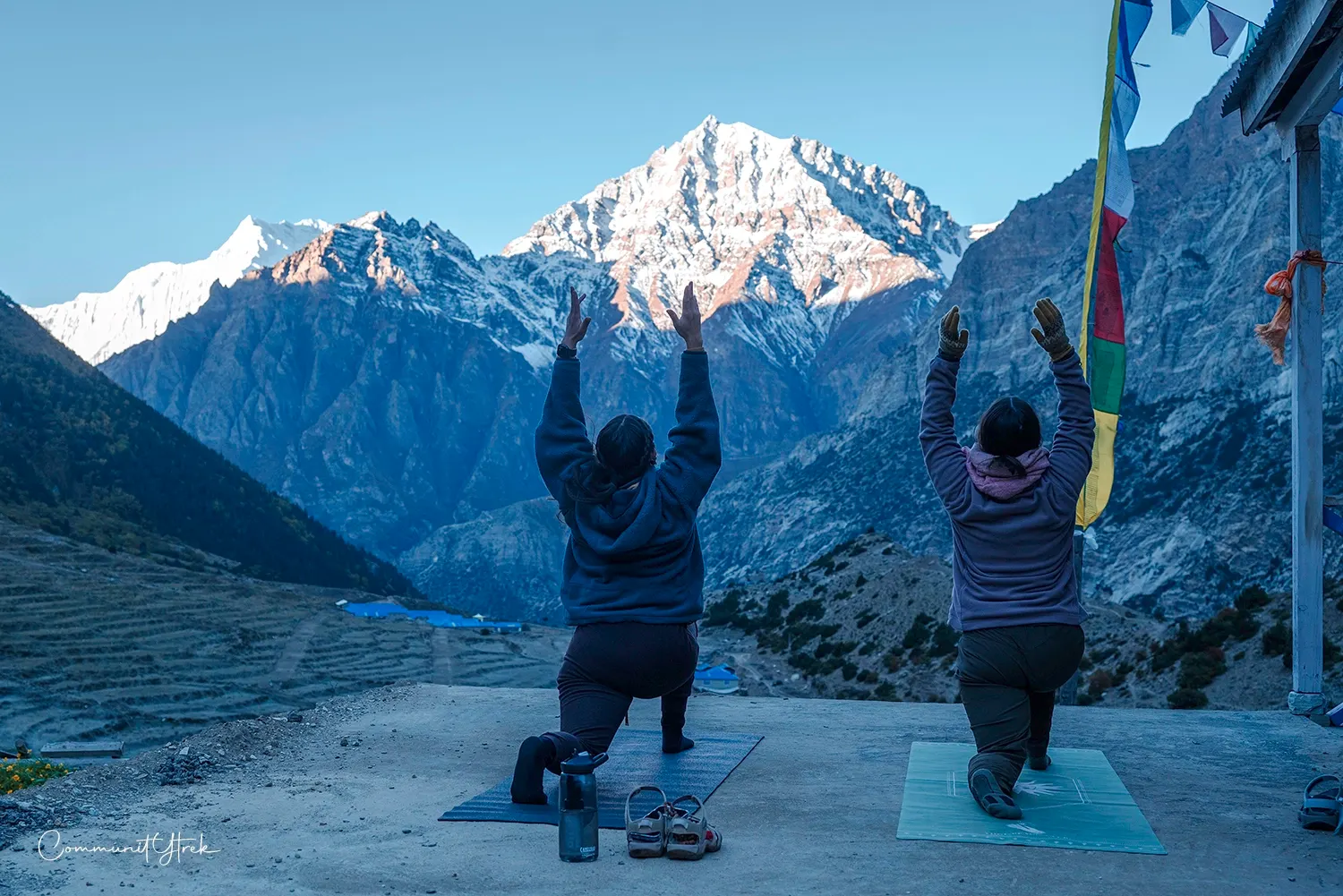 Person practicing yoga in the peaceful Himalayas of Nepal, surrounded by majestic mountain scenery.