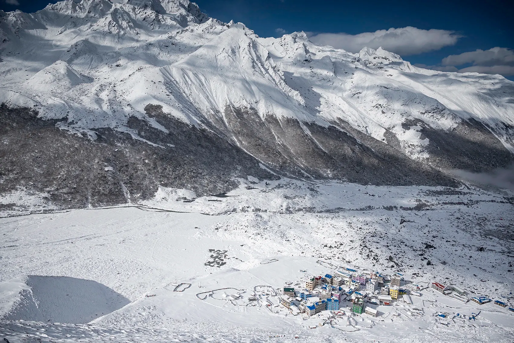 Langtang Valley in winter, a serene Himalayan landscape wrapped in snow, offering breathtaking mountain views and a peaceful trekking experience.