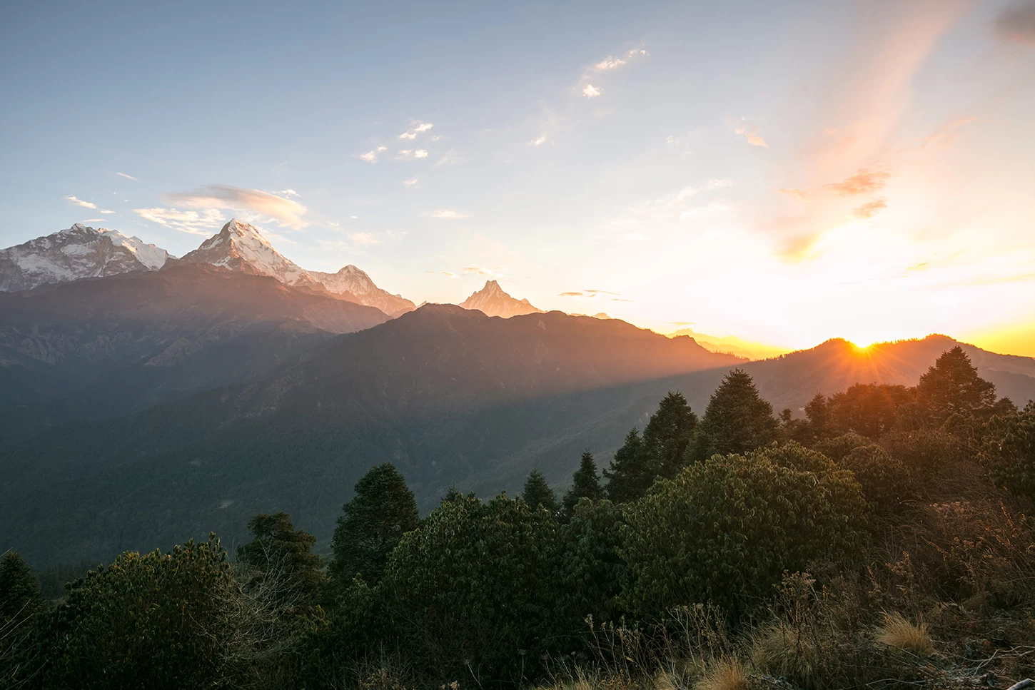 Sunrise over the Annapurna and Dhaulagiri mountain ranges viewed from Poon Hill near Ghorepani, Nepal.