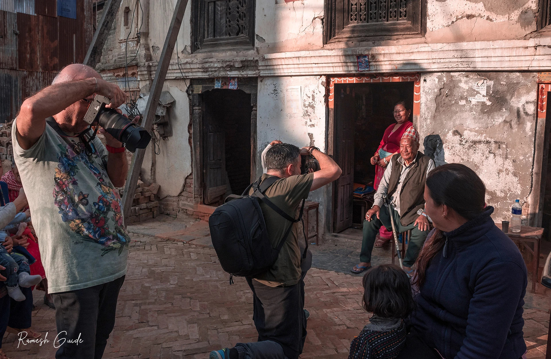 Photography tour team taking street portraits in Khokana Village, Lalitpur